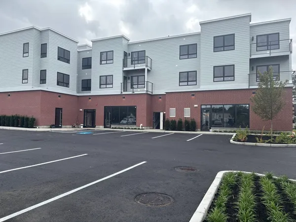 a front view of a multi story residential apartment building