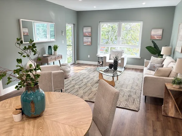 a living room with furniture and a large window