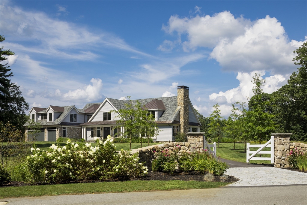 30 Field Road Sudbury, MA 01776 - Photo 1 of 38 a front view of a house with a garden