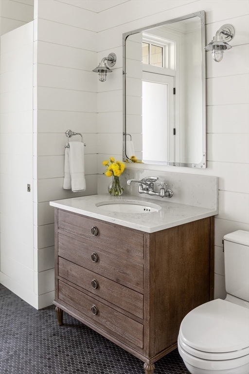 30 Field Road Sudbury, MA 01776 - Photo 15 of 38 a bathroom with a sink toilet vanity and mirror