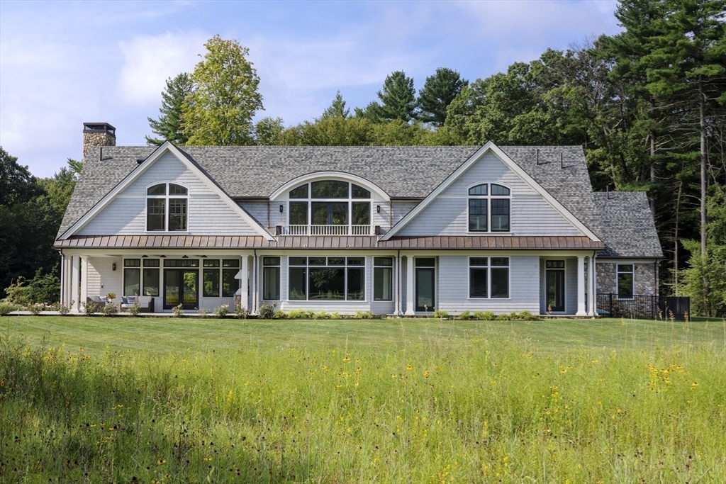 30 Field Road Sudbury, MA 01776 - Photo 24 of 38 a front view of a house with a garden