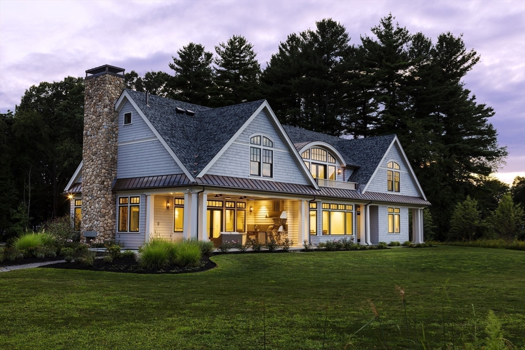 30 Field Road Sudbury, MA 01776 - Photo 26 of 38 a front view of a house with a garden