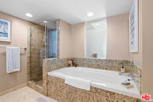 a bathroom with a bathtub and a sink