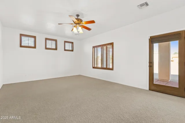 a spacious bathroom with a double vanity sink mirror and bathtub