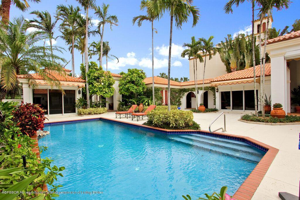 210 Wells Road Palm Beach, FL 33480 - Photo 2 of 12 a front view of house and yard with swimming pool