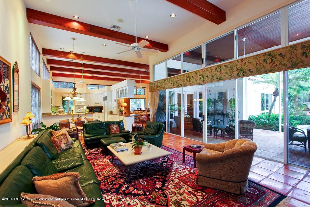 210 Wells Road Palm Beach, FL 33480 - Photo 6 of 12 a living room with furniture a rug and a large window