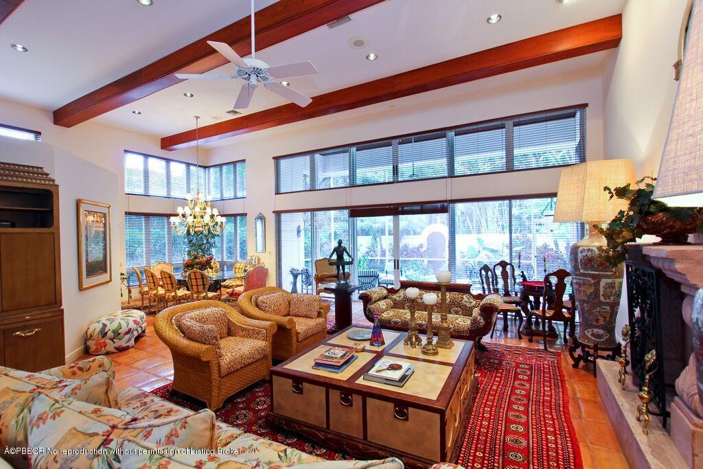 210 Wells Road Palm Beach, FL 33480 - Photo 9 of 12 a living room filled with furniture and a floor to ceiling window
