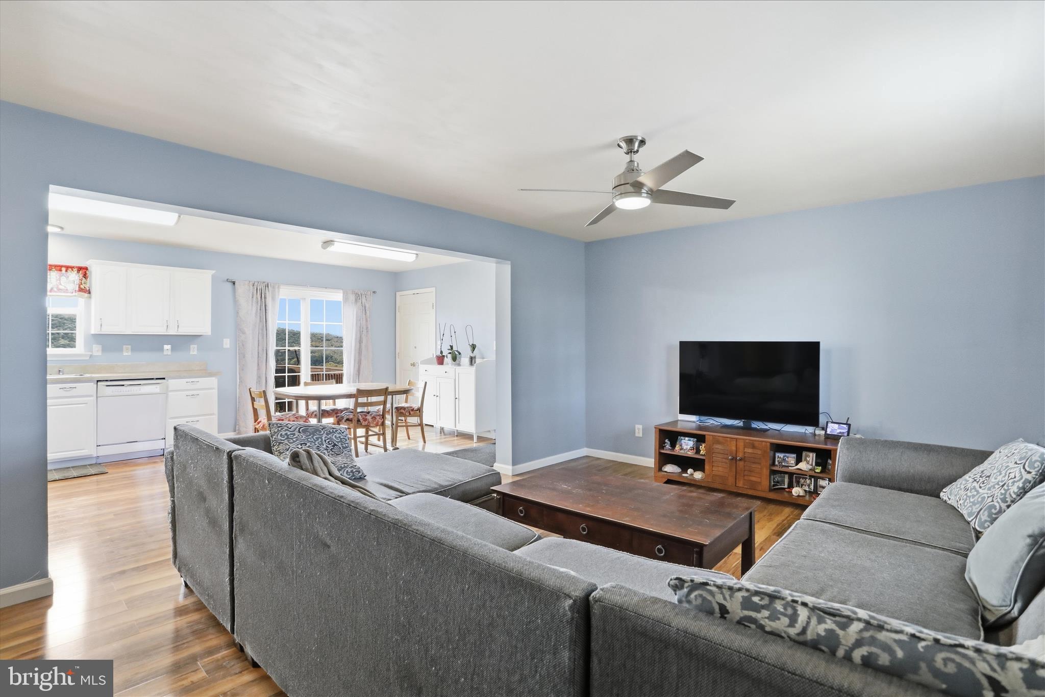 9580 Timber Ridge Road Big Cove Tannery, PA 17212 - Photo 11 of 56 a living room with furniture and a flat screen tv