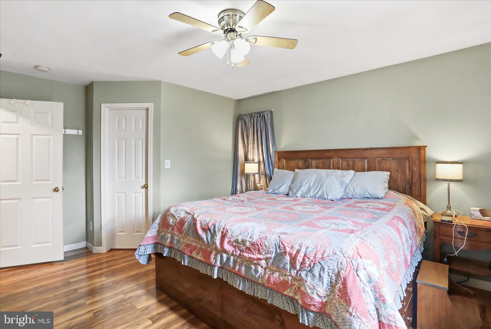 9580 Timber Ridge Road Big Cove Tannery, PA 17212 - Photo 17 of 56 a bedroom with a bed and a chandelier