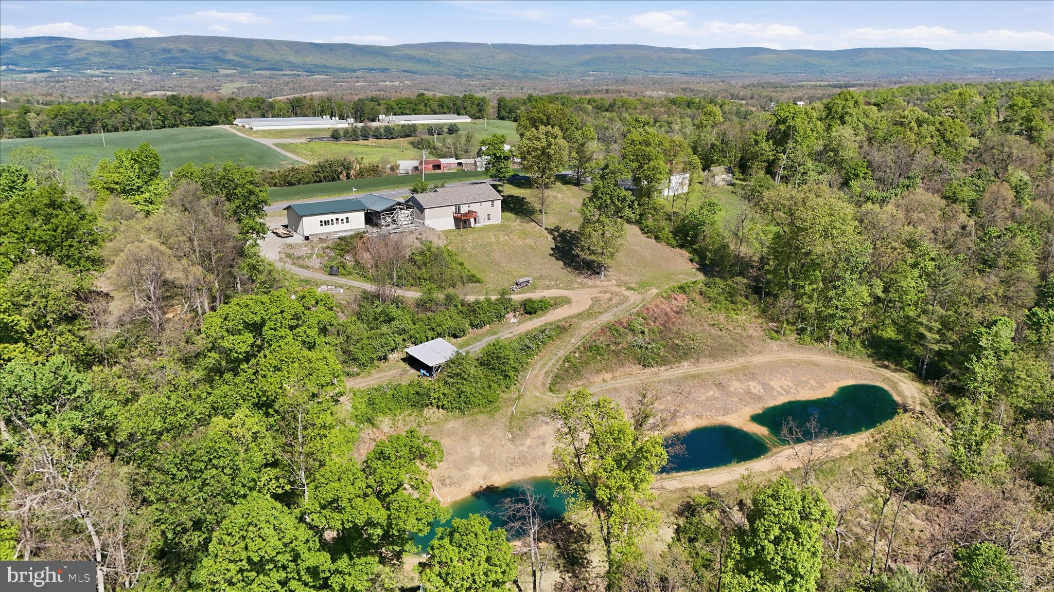 9580 Timber Ridge Road Big Cove Tannery, PA 17212 - Photo 47 of 56 a view of a lake with a mountain in the background