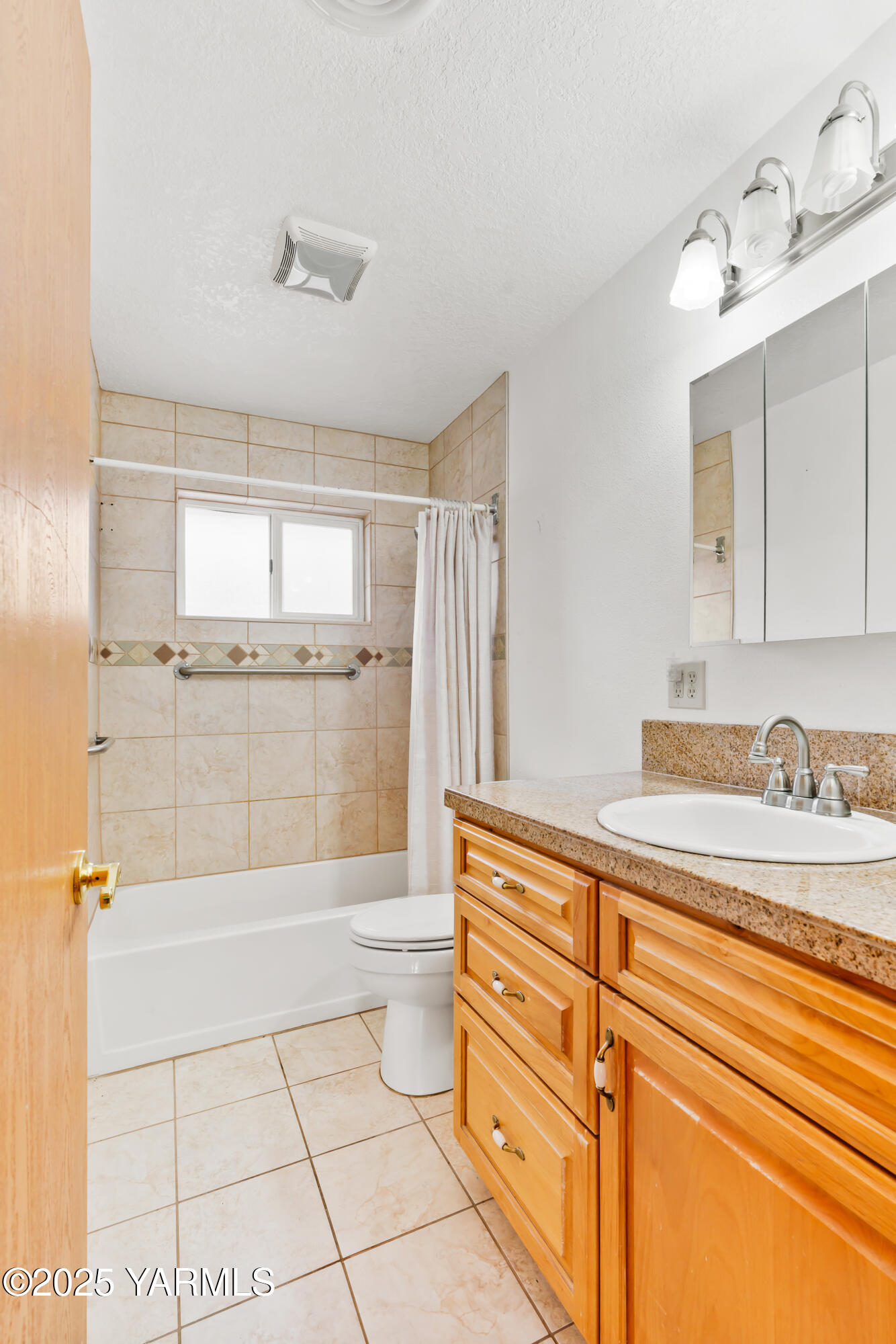 4101 Snowmountain Road Yakima, WA 98908 - Photo 13 of 15 a bathroom with a granite countertop sink a toilet and shower