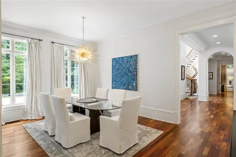 a living room with furniture and a lamp