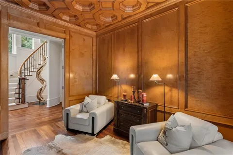 a spacious bedroom with a bed and a chandelier