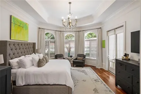 a bathroom with a double vanity sink a mirror and a bathtub