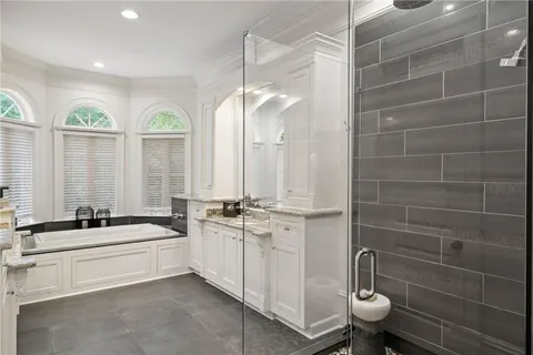 a living room with furniture and a bookshelf