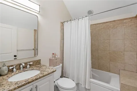 a kitchen with stainless steel appliances granite countertop a stove and a refrigerator