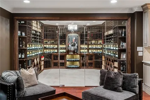a bathroom with a granite countertop sink a toilet and a mirror