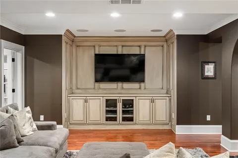 a view of a white house with a yard patio and couches chairs