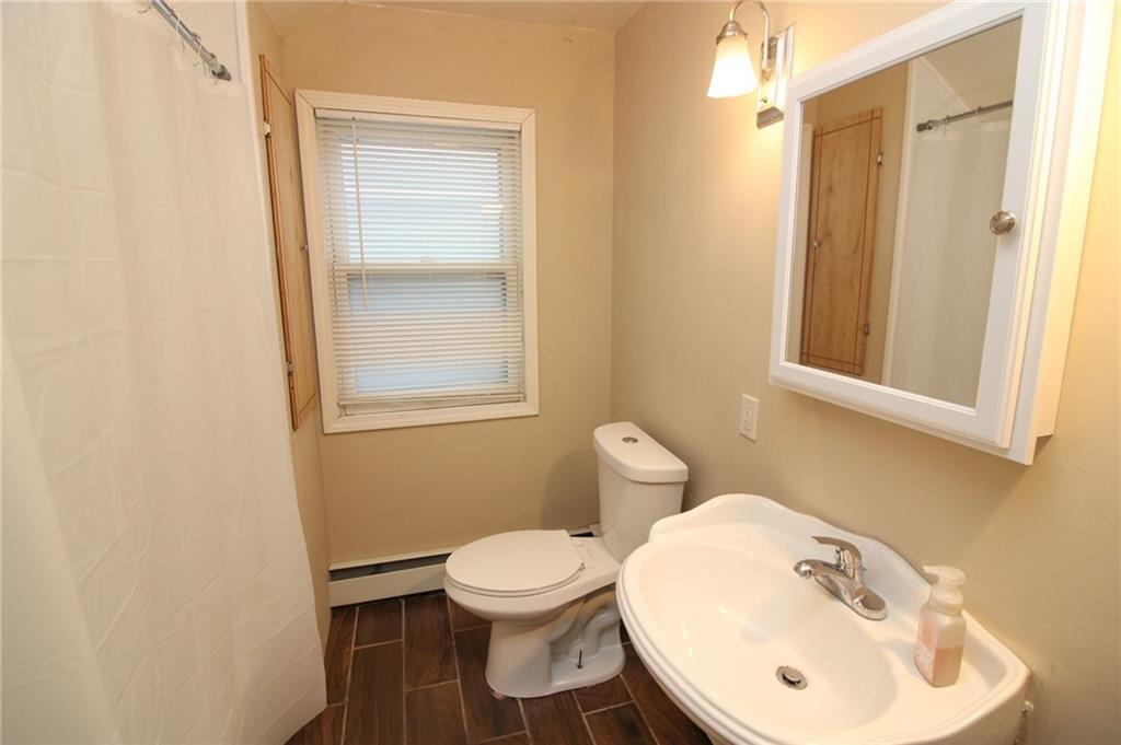 1443 State Avenue Coraopolis, PA 15108 - Photo 13 of 20 a bathroom with a toilet sink and mirror
