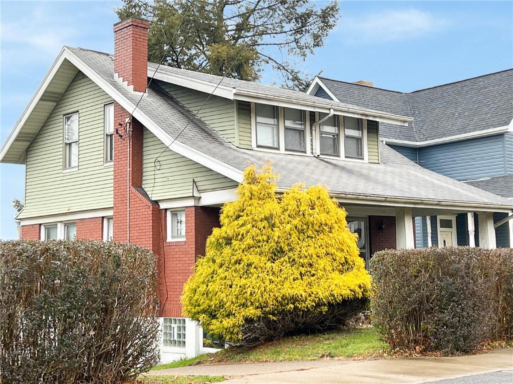 1443 State Avenue Coraopolis, PA 15108 - Photo 18 of 20 a front view of a house with a garden