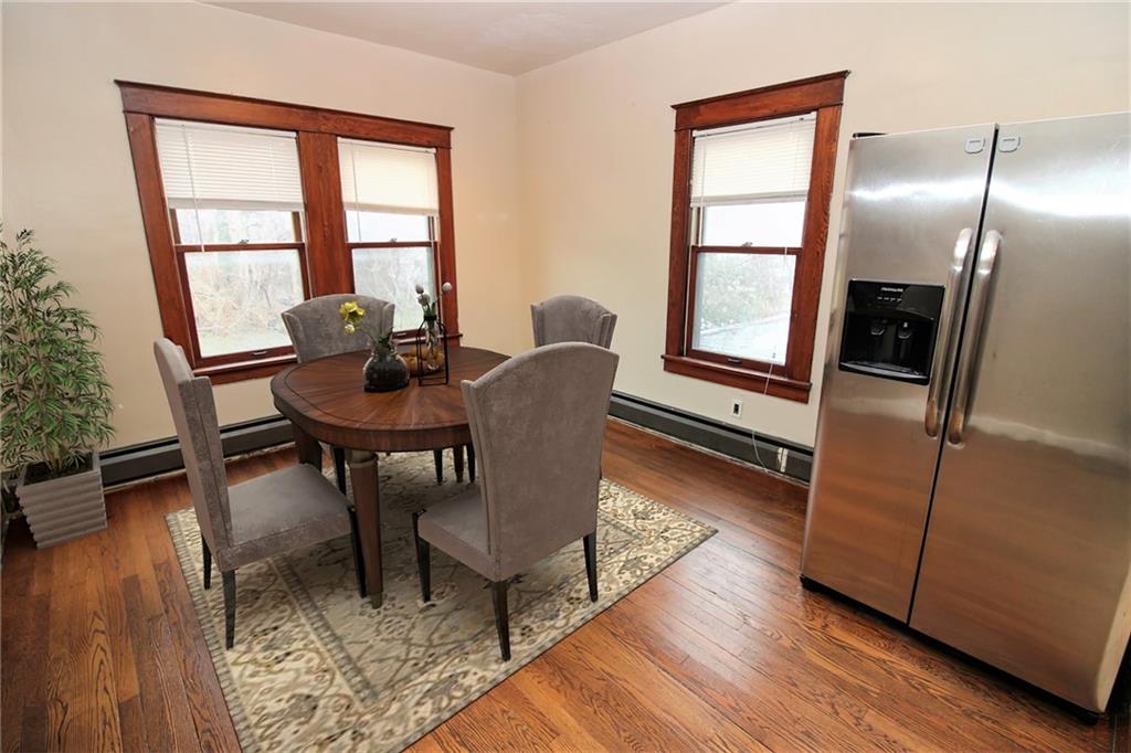 1443 State Avenue Coraopolis, PA 15108 - Photo 7 of 20 a dining room with furniture a rug and wooden floor