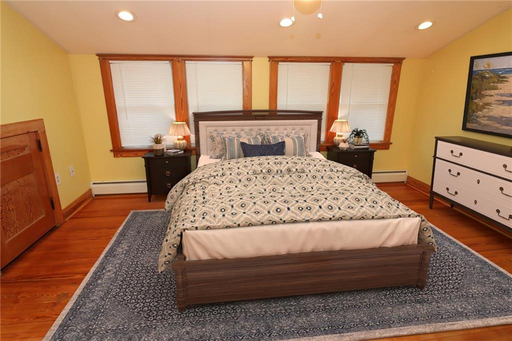 1443 State Avenue Coraopolis, PA 15108 - Photo 9 of 20 a bedroom with a bed and wooden floor