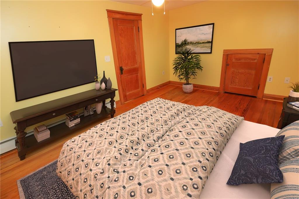 1443 State Avenue Coraopolis, PA 15108 - Photo 10 of 20 a bedroom with a bed and flat screen tv