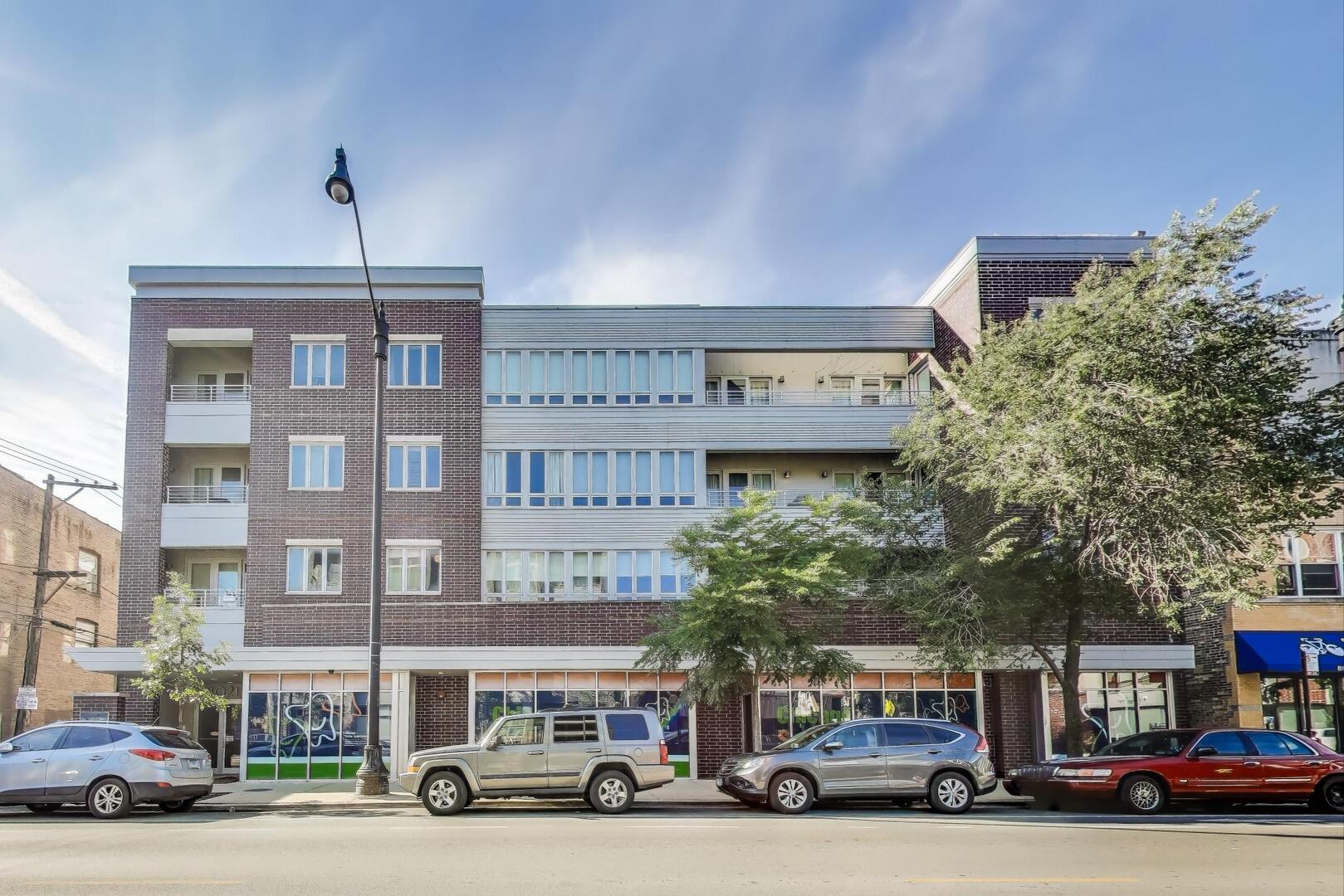 3021 West Armitage Avenue, Unit 208 Chicago, IL 60647 - Photo 1 of 18 a car parked in front of a building