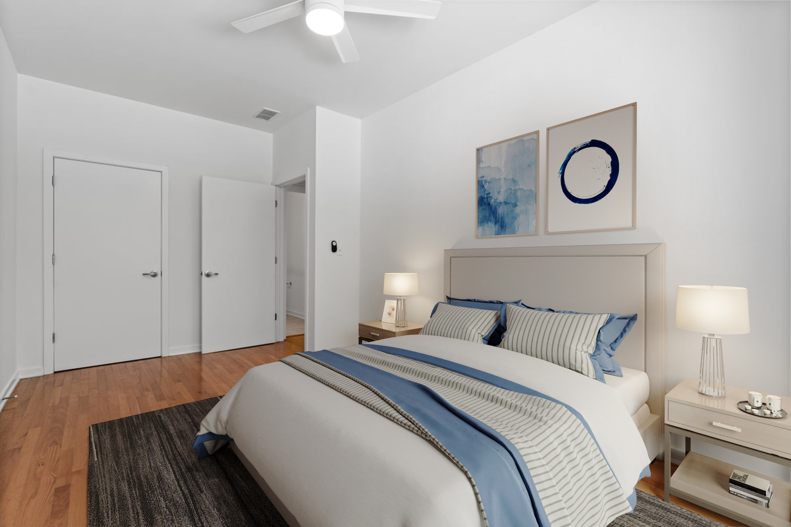 3021 West Armitage Avenue, Unit 208 Chicago, IL 60647 - Photo 12 of 18 a bedroom with a bed and a lamp on dresser