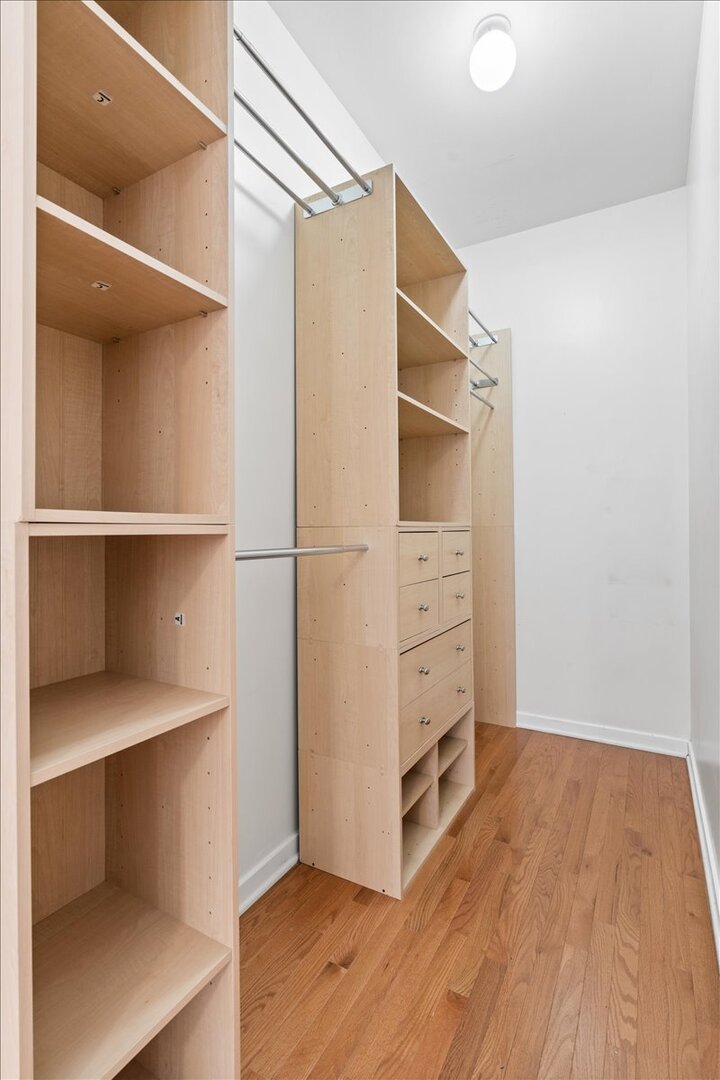 3021 West Armitage Avenue, Unit 208 Chicago, IL 60647 - Photo 13 of 18 a view of walk in closet with empty racks
