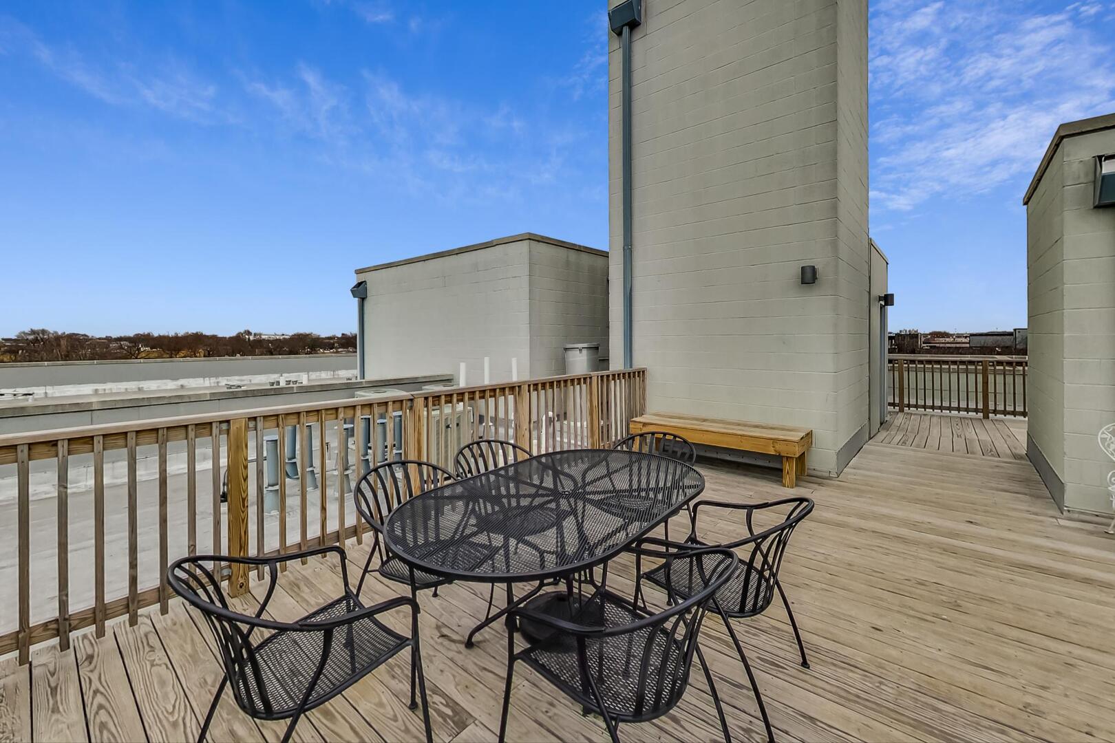 3021 West Armitage Avenue, Unit 208 Chicago, IL 60647 - Photo 17 of 18 a balcony with table and chairs