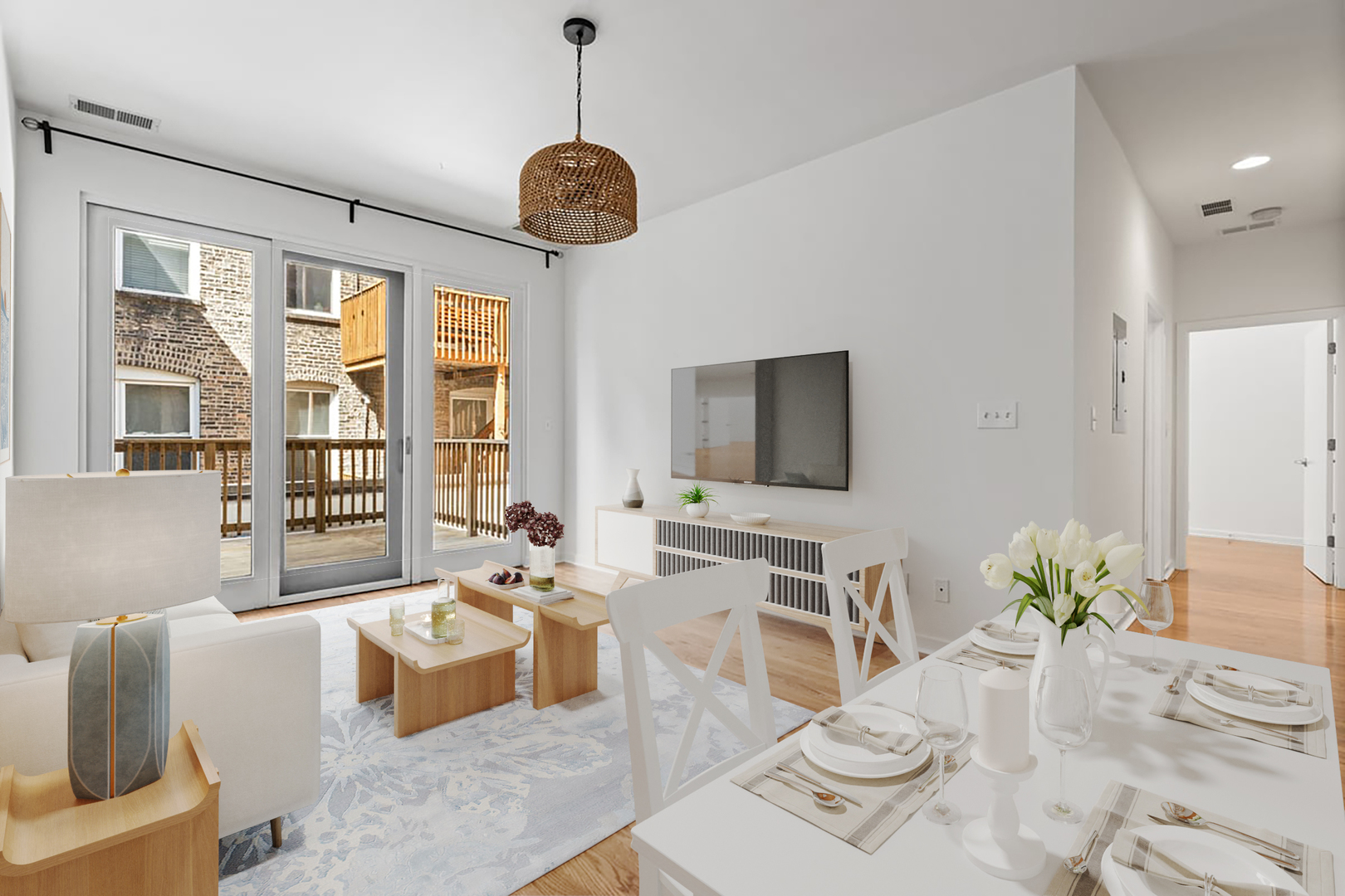 3021 West Armitage Avenue, Unit 208 Chicago, IL 60647 - Photo 3 of 18 a living room with furniture and a flat screen tv