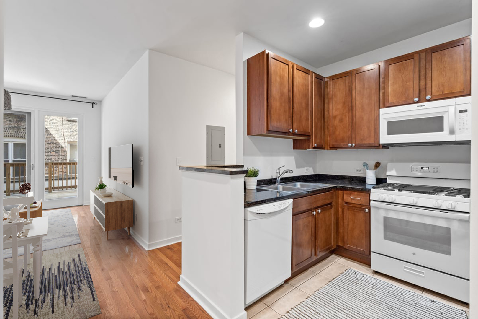 3021 West Armitage Avenue, Unit 208 Chicago, IL 60647 - Photo 6 of 18 a kitchen with stainless steel appliances granite countertop a stove a sink and a refrigerator