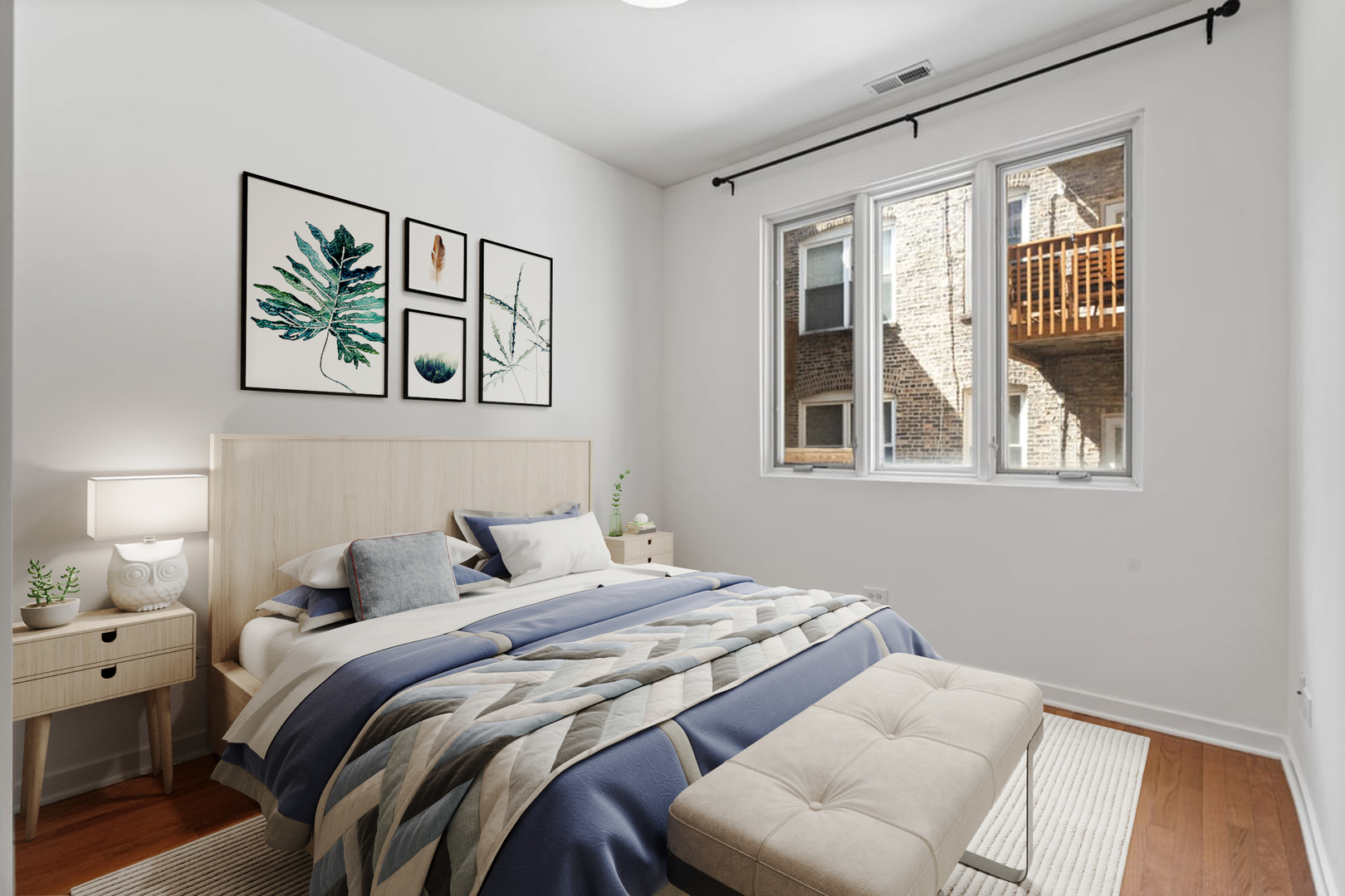 3021 West Armitage Avenue, Unit 208 Chicago, IL 60647 - Photo 10 of 18 a bedroom with a bed and a painting on the wall