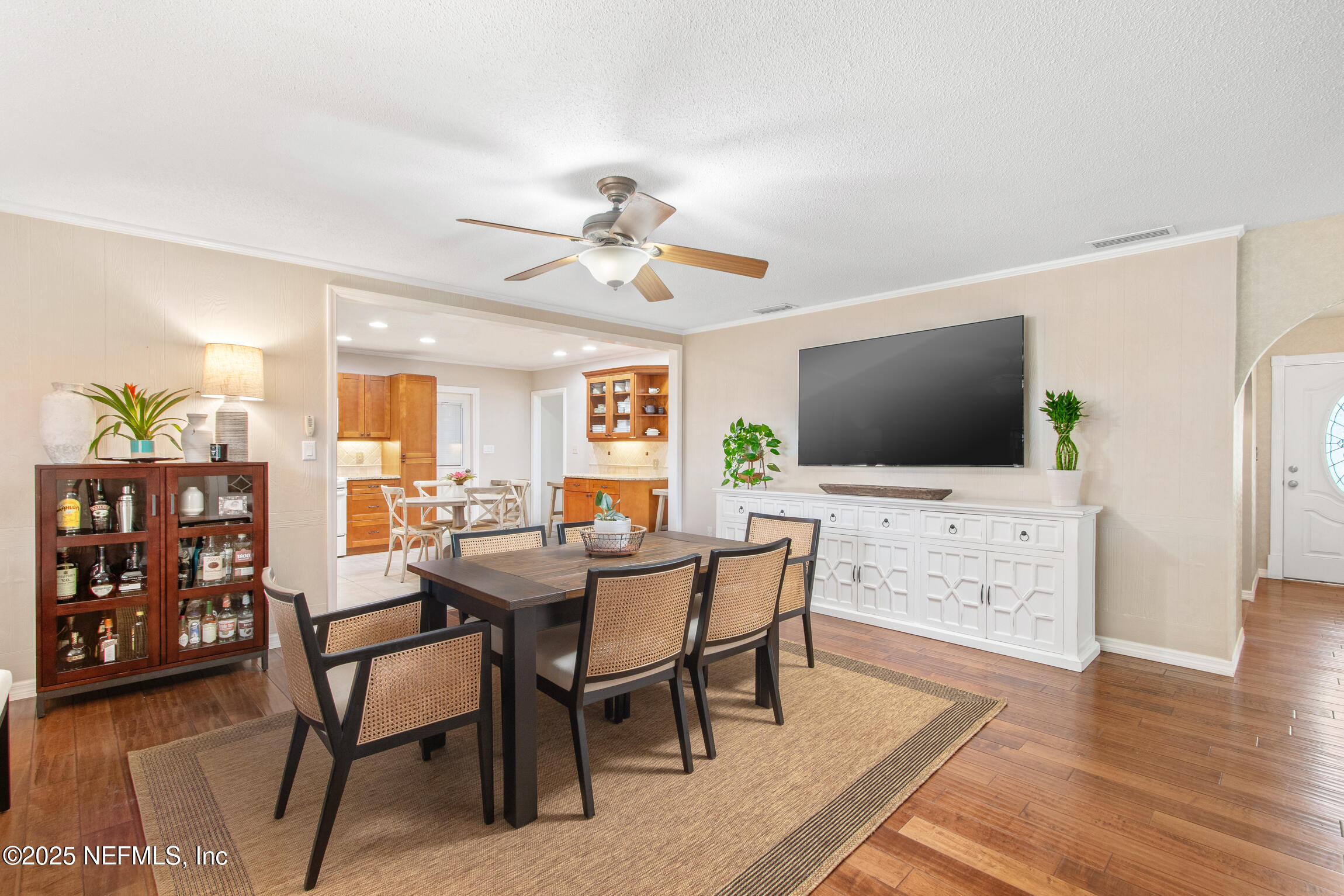 405 Lobelia Road St. Augustine, FL 32086 - Photo 16 of 40 a view of a dining room with furniture window and wooden floor