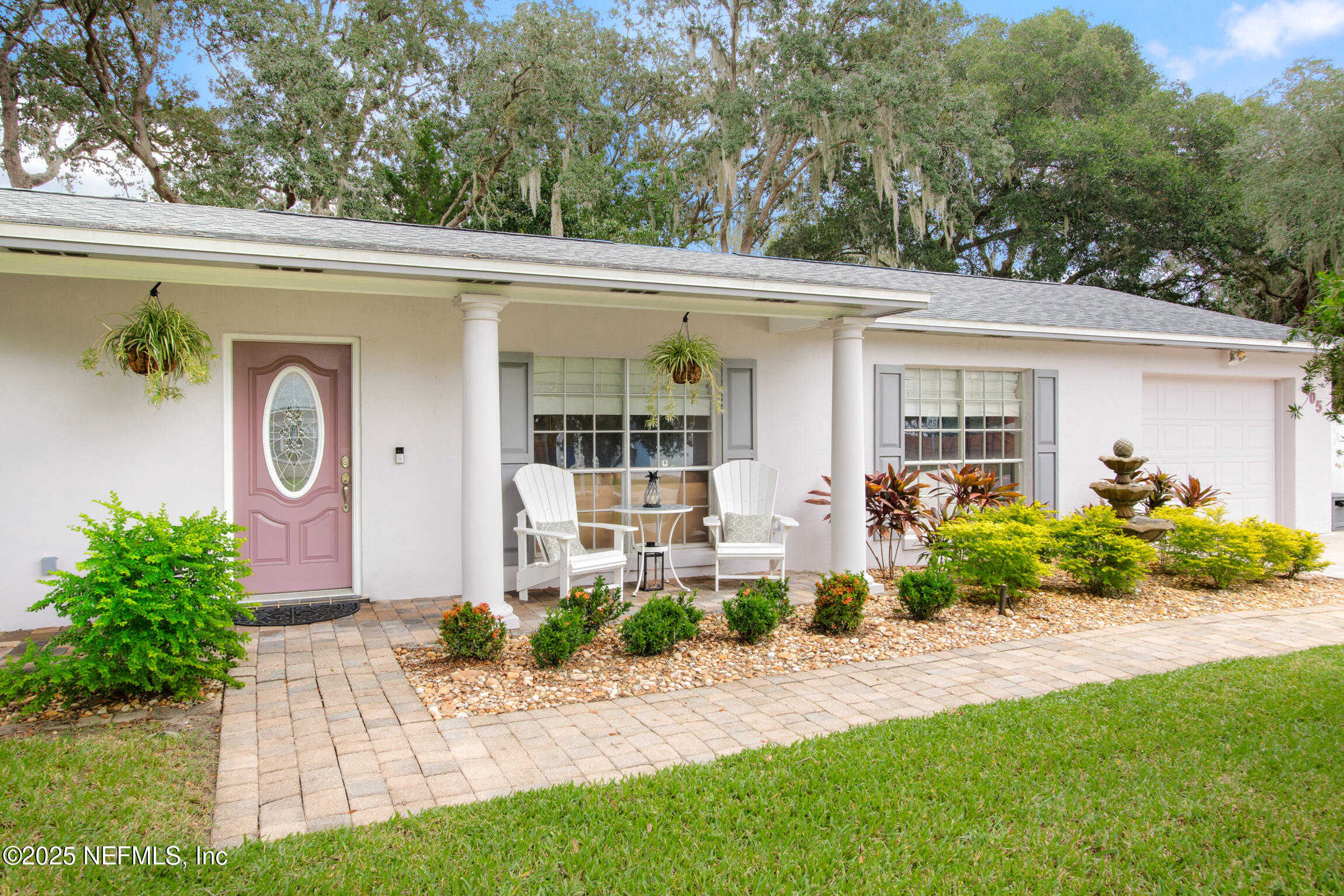 405 Lobelia Road St. Augustine, FL 32086 - Photo 2 of 40 a front view of a house with garden