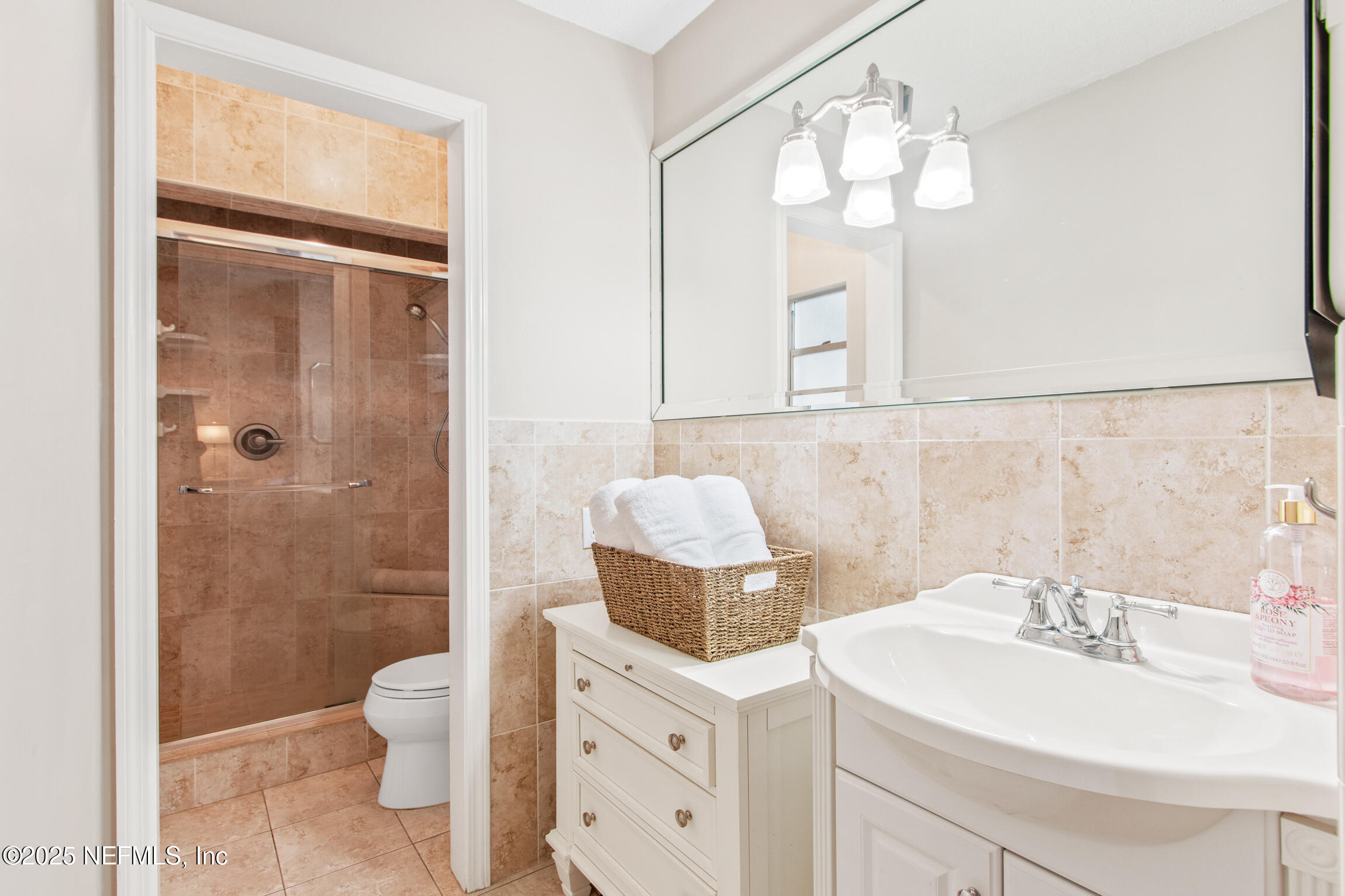 405 Lobelia Road St. Augustine, FL 32086 - Photo 24 of 40 a bathroom with a sink toilet and shower