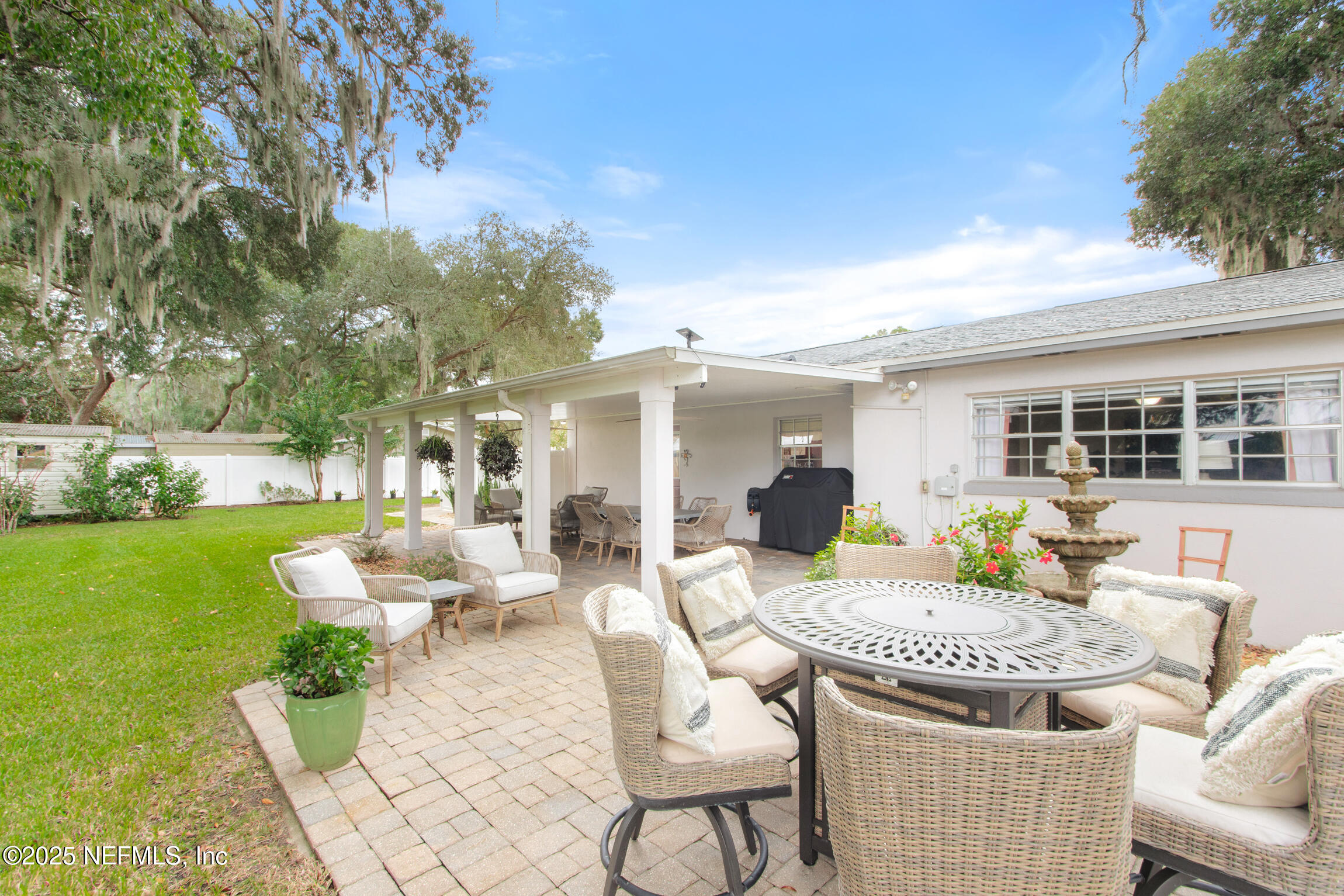 405 Lobelia Road St. Augustine, FL 32086 - Photo 30 of 40 a view of an house with backyard and furniture