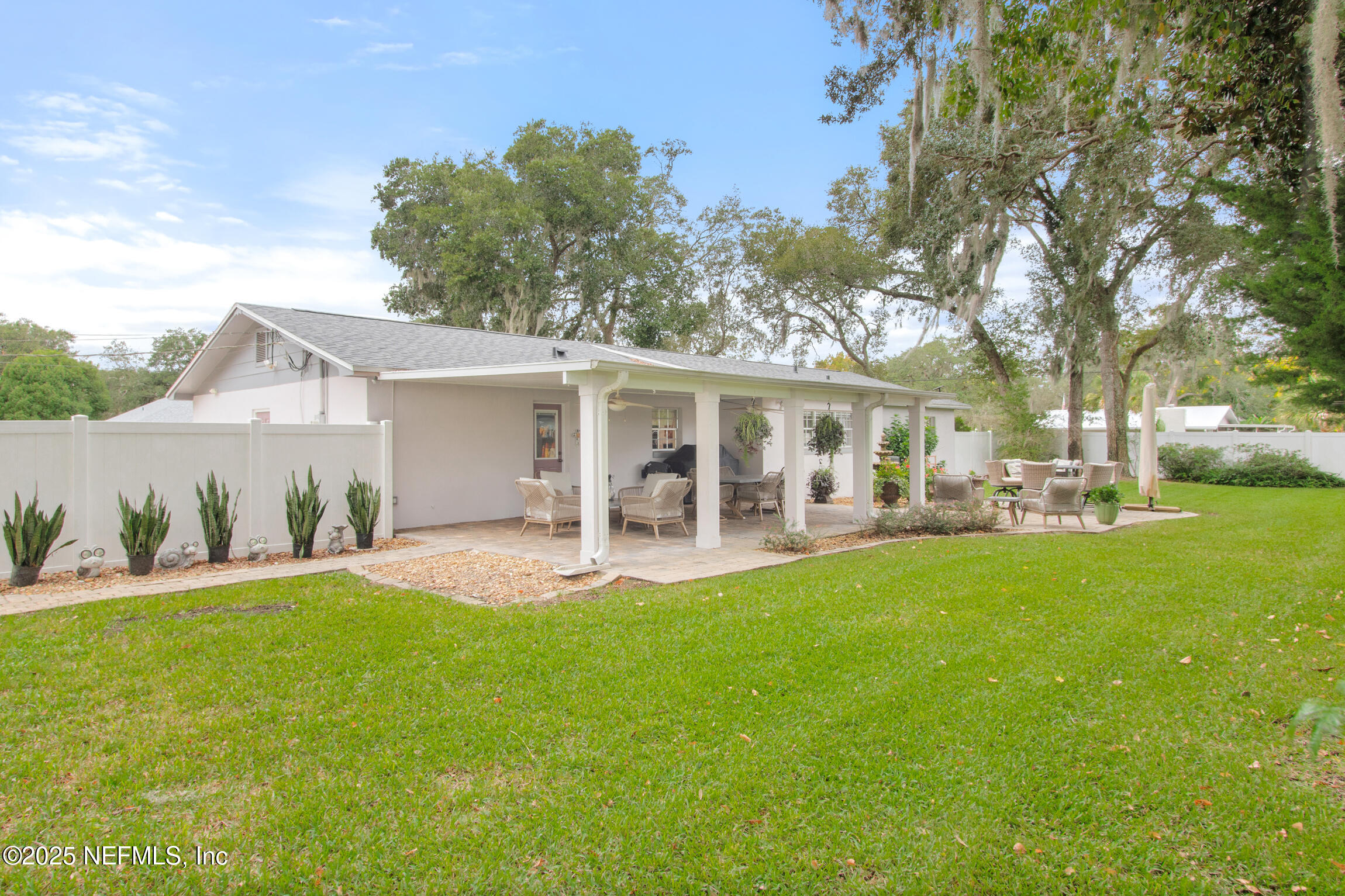405 Lobelia Road St. Augustine, FL 32086 - Photo 32 of 40 a view of a house with a yard and sitting area