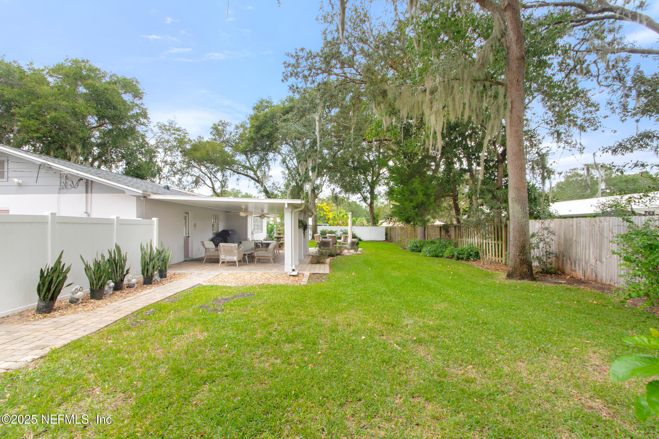 405 Lobelia Road St. Augustine, FL 32086 - Photo 33 of 40 a view of a house with backyard and sitting area