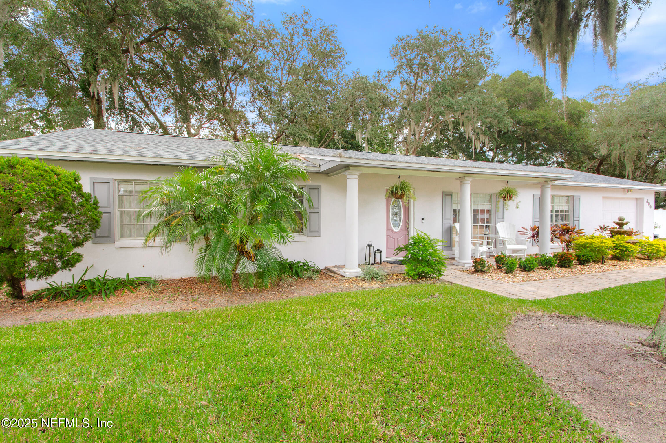 405 Lobelia Road St. Augustine, FL 32086 - Photo 34 of 40 front view of house with a yard and potted plants