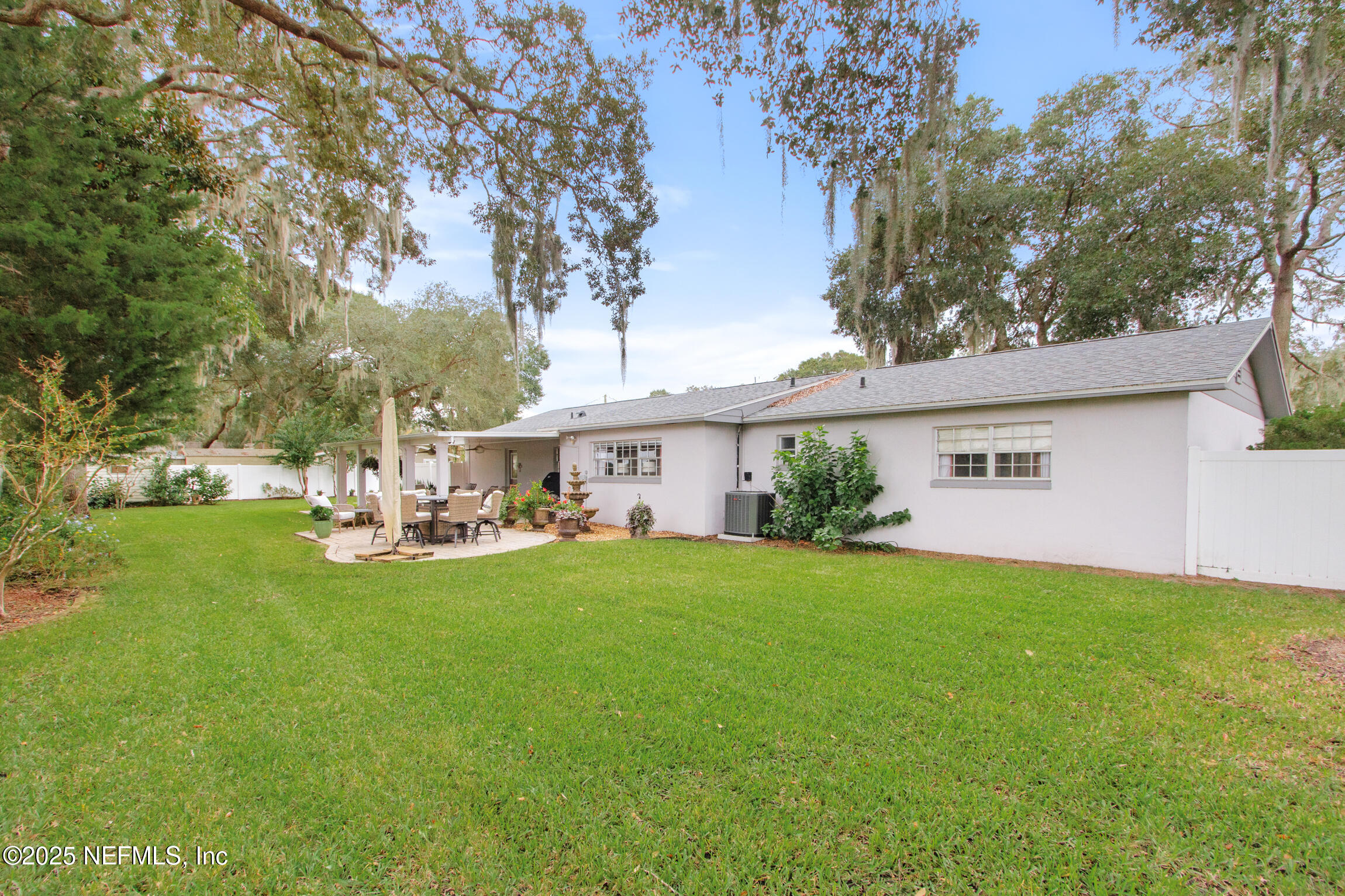 405 Lobelia Road St. Augustine, FL 32086 - Photo 35 of 40 a view of a house with backyard and sitting area