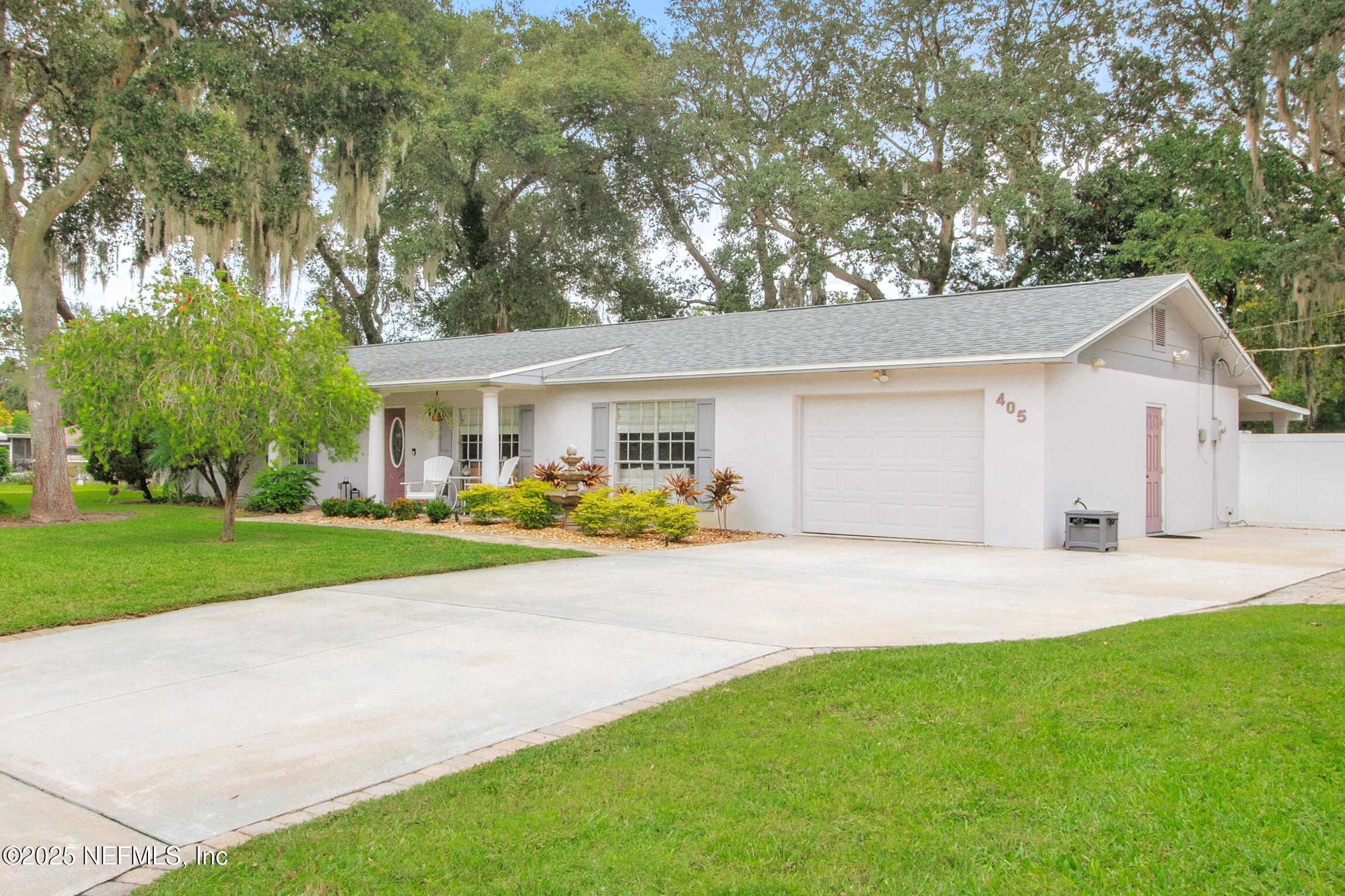 405 Lobelia Road St. Augustine, FL 32086 - Photo 36 of 40 a front view of a house with a yard and porch