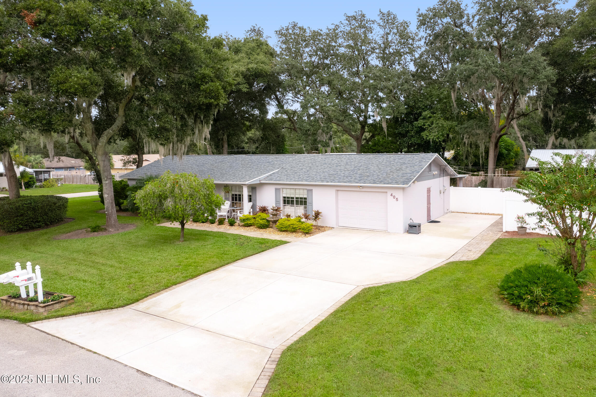 405 Lobelia Road St. Augustine, FL 32086 - Photo 40 of 40 a front view of a house with garden