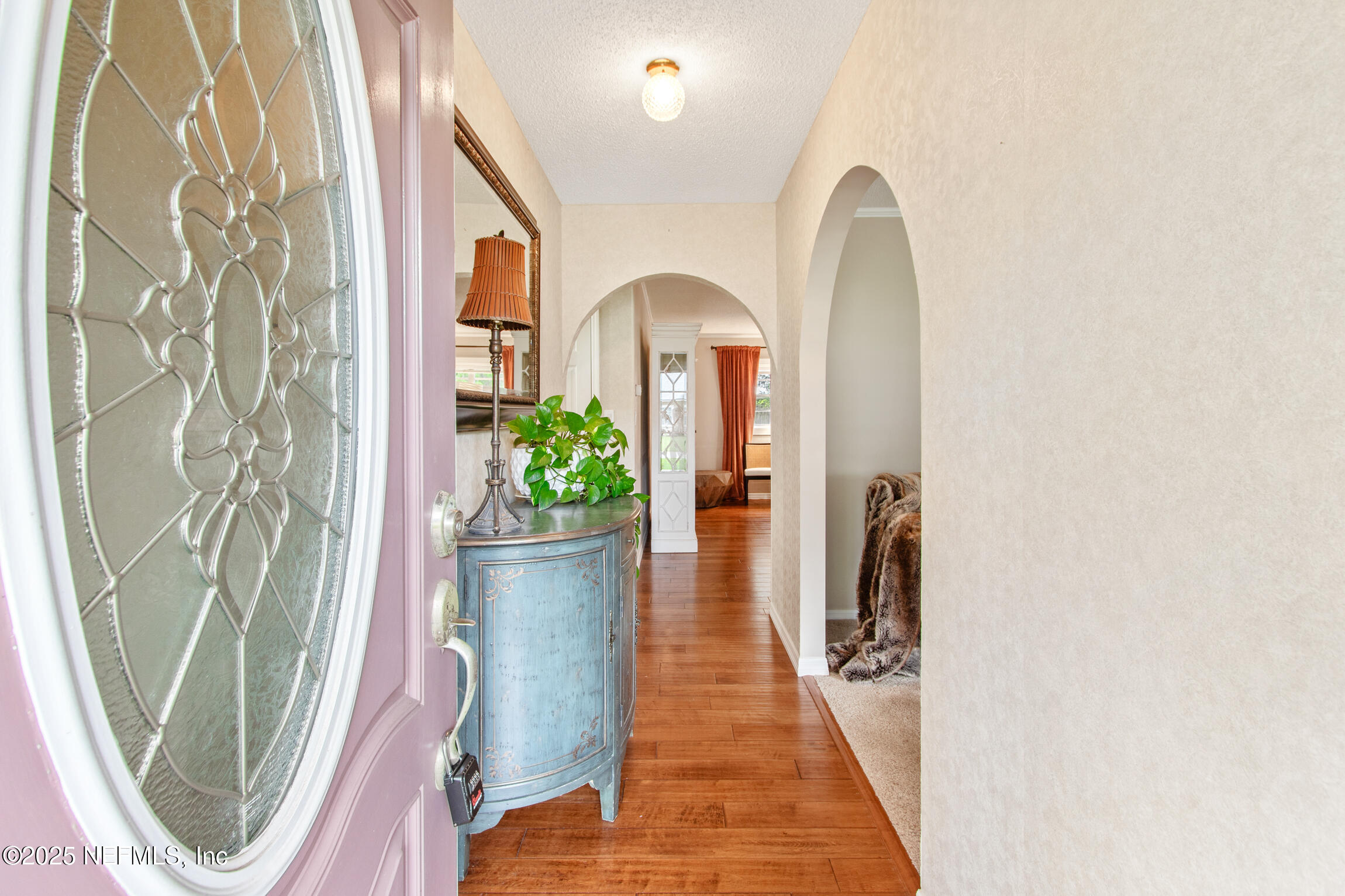 405 Lobelia Road St. Augustine, FL 32086 - Photo 5 of 40 a front view of a house with wooden floor and stairs