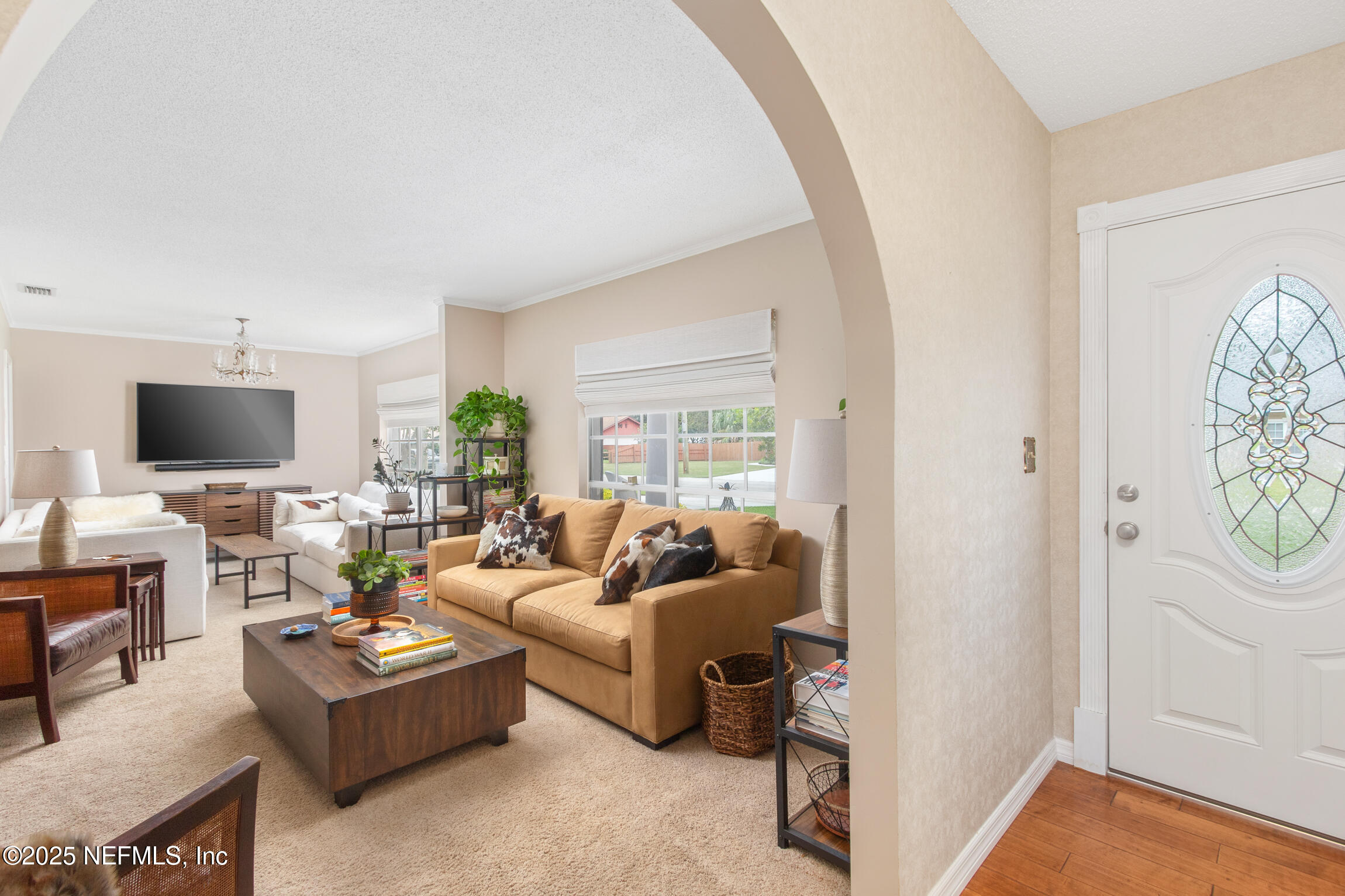405 Lobelia Road St. Augustine, FL 32086 - Photo 6 of 40 a living room with furniture and a flat screen tv