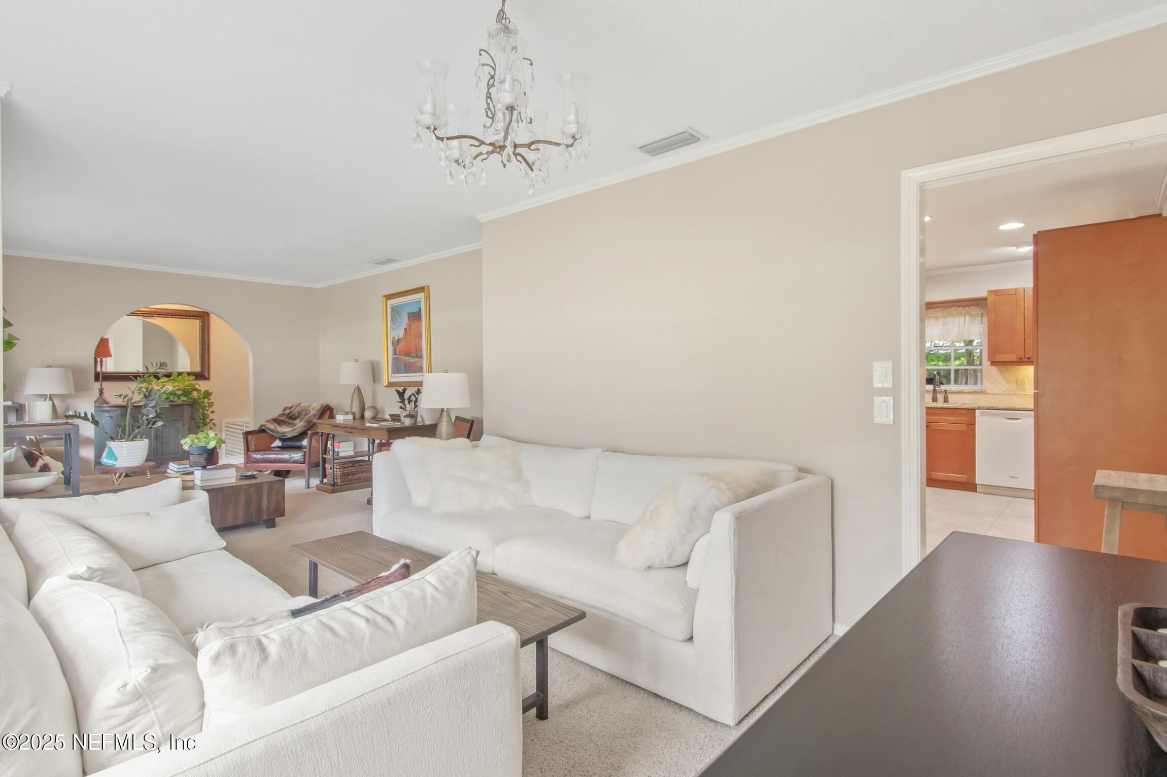 405 Lobelia Road St. Augustine, FL 32086 - Photo 9 of 40 a living room with furniture and a chandelier