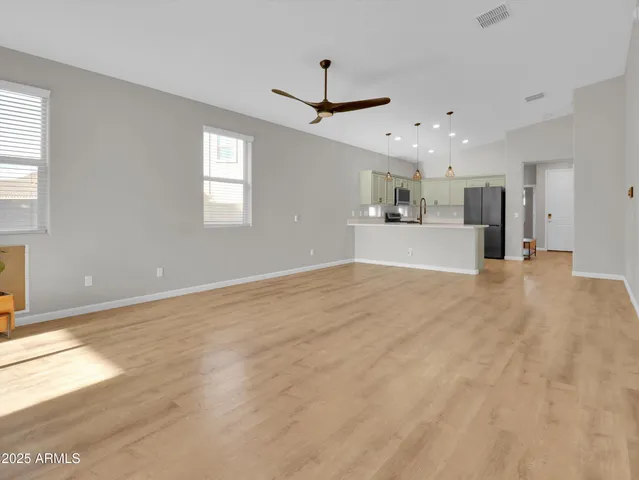 a kitchen with stainless steel appliances a stove sink and microwave