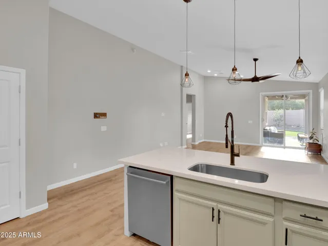 a view of a kitchen with a sink and a window