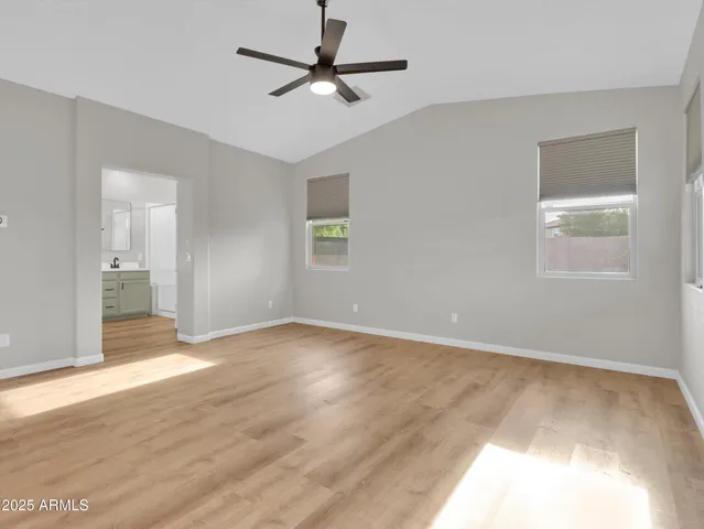 a view of a room with wooden floor